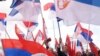 (FILE) Supporters of Bosnian Serb political leader Milorad Dodik wave Serbian flags during protest against what he claims is Western aggression against Republika Srpska entity in the Bosnian town of Banja Luka.
