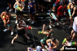 Locals and tourists play with water as they celebrate the Songkran holiday which marks the Thai New Year in Bangkok, Thailand, April 13, 2024.