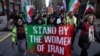 FILE - Protesters call on the United Nations to take action against the treatment of women in Iran, following the death in police custody of Mahsa Amini, during a rally in New York City, Nov. 19, 2022.