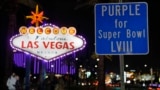 The Welcome to Las Vegas is outlined in purple for the Super Bowl, Feb. 6, 2024, in Las Vegas. On Sunday, the city will host the Kansas City Chiefs and the San Francisco 49ers in Super Bowl 58. (AP Photo/Charlie Riedel)