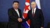 (FILE) Russian President Vladimir Putin, right, and North Korea's leader Kim Jong Un shake hands. 
