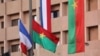 FILE - A French flag flies next to a Burkina Faso flag in Ouagadougou, Nov. 27, 2017. The African country has expelled three French diplomats, a government statement announced April 18, 2024.