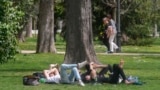 FILE - People relax in the Retiro park in Madrid, Spain, March 20, 2024. Earth just had its warmest March ever recorded, according to the European Union climate agency Copernicus. (AP Photo/Paul White, File)