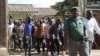 Zimbabwe Prisons and Correctional Services officials open gates to allow pardoned prisoners to leave, at Chikurubi Maximum Prison in Harare, on April 19, 2024. (Columbus Mavhunga/VOA)