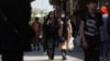FILE - Iranian women walk on a street amid the implementation of new hijab-related surveillance in Tehran, Iran, April 15, 2023. (West Asia News Agency via Reuters)