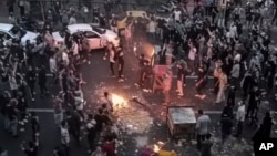 FILE - Iranians protest in Tehran on Sept. 20, 2022. Documents apparently hacked from an Iranian government database have shed new light on how Iran's Islamist rulers covered up casualties from violent crackdowns on mostly peaceful protests.