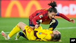 Spain's Ivana Andres celebrates with goalkeeper Cata Coll, on the ground, at the end of the Women's World Cup soccer final between Spain and England at Stadium Australia in Sydney, Australia, Aug. 20, 2023. 