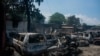 FILE - The charred remains of vehicles that were burned near a garage are seen in Port-au-Prince, Haiti, on March 25, 2024. The UN described the situation in the chaos-wracked country as 'cataclysmic.'