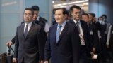 Former Taiwanese President Ma Ying-jeou, center, walks to a gate before leaving for China at Taoyuan International Airport in Taoyuan City, Taiwan, April 1, 2024. 