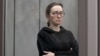 FILE - Alsu Kurmasheva, a journalist with Radio Free Europe/Radio Liberty who is in custody after she was accused of violating Russia's law on foreign agents, attends a court hearing in Kazan, Russia, Feb. 1, 2024.