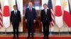 President Joe Biden, center, Philippine President Ferdinand Marcos Jr., left, and Japanese Prime Minister Fumio Kishida pose before a trilateral meeting in the East Room of the White House in Washington, April 11, 2024.