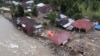 Homes damaged by a flash flood sit in Pesisir Selatan, West Sumatra, Indonesia, March 13, 2024. In Indonesia, environmental groups point to deforestation and environmental degradation worsening the effects of natural disasters such as floods, landslides, drought and forest fires.