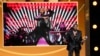 Usher speaks to the audience after winning Entertainer of the Year during the 55th NAACP Image Awards, March 16, 2024, at The Shrine Auditorium in Los Angeles. (AP Photo/Chris Pizzello)