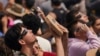 People use special glasses to watch a total solar eclipse in Mazatlan, Mexico, April 8, 2024. 