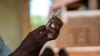 Health officials prepare to administer a vaccine in the Malawi village of Tomali with the world's first vaccine against malaria in a pilot program in Tomali, Dec. 11, 2019. (AP Photo/Jerome Delay, File)