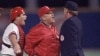 FILE - St. Louis Cardinals manager Whitey Herzog, middle, lets umpire John Shulock, right, know how he feels about Shulock's call during Game 5 of the World Series in St. Louis, Missouri, Oct. 24, 1985. Cardinals catcher Tom Nieto, left, also shares his thoughts.