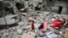 Palestinian children inspect the site of an Israeli strike on a house, amid the ongoing conflict between Israel and the Palestinian Islamist group Hamas, in Rafah in the southern Gaza Strip, April 27, 2024.