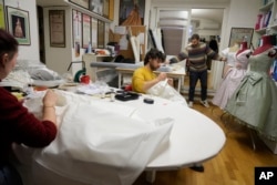 Dressmakers work at the Tirelli Atelier in Rome, Tuesday, March 5, 2024. Established in November 1964, the shop on a quiet Roman street has been behind 17 Academy Awards for Best Costume Design. (AP Photo/Gregorio Borgia)