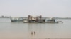 FILE - A ferry is shown on March 18, 2024, along the Mekong River where a proposed canal is planned.