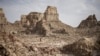 A man walks through a salt canyon, near Dallol, in the Danakil Depression of the Afar region, Ethiopia, March 24, 2024. 