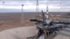 In this photo taken from video by Roscosmos, a Soyuz-2.1a rocket booster with a Soyuz MS-25 space capsule carrying a crew of three stands on its pad after its launch was aborted, at the Russia-leased Baikonur cosmodrome, in Kazakhstan, March 21, 2024.