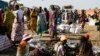 FILE - Internally displaced women wait for food rations to be distributed by the World Food Program in Bentiu, South Sudan, Feb. 6, 2023.