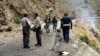 FILE - Security personnel inspect the site of a suicide attack in the Shangla district of Pakistan's Khyber Pakhtunkhwa province on March 26, 2024. Five Chinese nationals working on a construction site were killed along with their driver by a suicide bomber.
