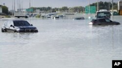 Vehicles sit abandoned in floodwater covering a major road in Dubai, United Arab Emirates. Heavy thunderstorms lashed the United Arab Emiratesy, dumping over a year and a half&#39;s worth of rain on the desert city-state of Dubai over a period of hours.