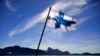 FILE - Finland's flag flies aboard the Finnish icebreaker MSV Nordica as it arrives at Nuuk, Greenland, July 29, 2017. Finland has again come out on top of an international index that ranks nations by how happy they are as places to live.