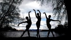 Scottish Ballet dancers Seira Winning Urara Takata and Danila Marzilli dance on the banks of Loch Lomond near Glasgow, in Scotland, Britain, March 26, 2024. 