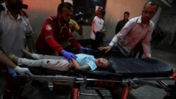 A young Palestinian wounded in the Israeli bombardment of the Gaza Strip is brought to the Kuwaiti Hospital in Rafah refugee camp, southern Gaza Strip, April 20, 2024. 