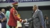 FILE - Gabon Transitional President General Brice Oligui Nguema, left, shakes hands with the President of the Central African Republic Faustin-Archange Touadera at the opening of the National Dialogue in Gabon in Libreville, April 2, 2024. 