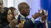 Michel Patrick Boisvert, who was named interim prime minister by the cabinet of outgoing Prime Minister Ariel Henry, toasts the transitional council that will select Haiti's new prime minister and cabinet in Port-au-Prince, Haiti, April 25, 2024.