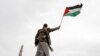 A Houthi supporter waves a Palestinian flag during a rally against the U.S.-led strikes against Yemen and in support of Palestinians in the Gaza Strip, in Sanaa, Yemen, April 26, 2024.