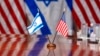 Israeli and U.S. flags are reflected on a conference table where Defense Secretary Lloyd Austin met with Israeli Defense Minister Yoav Gallant, at the Pentagon, March 26, 2024, in Washington.