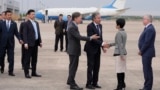 U.S. Secretary of State Antony Blinken, third from right, speaks to other officials as he prepares to depart Shanghai Hongqiao International Airport for Beijing, China, April 25, 2024.