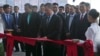 Cambodian Prime Minister Hun Manet, center, cuts the ribbon to inaugurate the Siem Reap-Angkor International Airport, in Cambodia, Thursday, Nov. 16, 2023.