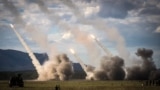 FILE - A missile is launched from a U.S. military HIMARS system during joint military drills at a firing range in northern Australia as part of Exercise Talisman Sabre, in Shoalwater Bay, July 22, 2023. 