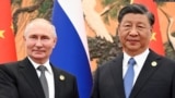 资料图： 2023年10月18日俄罗斯总统普京(左)与中国国家主席习近平在北京出席“一带一路”高峰论坛期间举行会晤。（路透社）