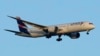 FILE - A LATAM Airlines Boeing 787 approaches for landing in Lisbon at sunrise, July 5, 2023. 