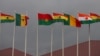 FILE - National flags of the Economic Community of West African States (ECOWAS) member states fly at the Kotoka Internatinal Airport in Accra, Ghana, on September 15, 2020. 