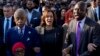From left, the Rev. Al Sharpton, Vice President Kamala Harris and Attorney Ben Crump sing as they and others walk across the Edmund Pettus Bridge, marking the 59th anniversary of the 1965 Bloody Sunday voting rights march in Selma, Alabama, March 3, 2024.