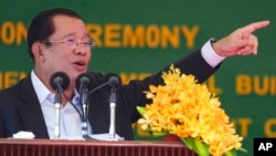 FILE - Cambodian Prime Minister Hun Sen speaks at the launching ceremony of the Cambodia-China Friendship Preah Kossamak Hospital in Phnom Penh, Cambodia, March 21, 2022. 