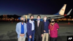 A delegation of American lawmakers pose for a photo after arriving at Songshan airport in Taipei, Taiwan on Sunday, Aug 14, 2022. (Taiwan Ministry of Foreign Affairs via AP)