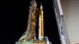 The NASA Artemis rocket with the Orion spacecraft aboard leaves the Vehicle Assembly Building moving slowly to pad 39B at the Kennedy Space Center in Cape Canaveral, Fla., Tuesday, Aug. 16, 2022. (AP Photo/Terry Renna)