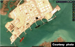 This satellite photo shows what TankerTrackers.com says is oil tanker Molecule (easternmost of three pictured tankers) berthed at Iran's Bandar e-Mahshahr port on Aug. 10, 2022 (ESA)