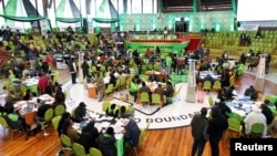 Various political parties' delegates and officials from the Independent Electoral and Boundaries Commission (IEBC) meet at the IEBC National Tallying centre at the Bomas of Kenya, in Nairobi, Aug. 13, 2022.