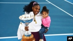 FILE - Serena Williams holds her daughter Alexis Olympia Ohanian Jr., and the ASB trophy after winning the ASB Classic in Auckland, New Zealand, Sunday, Jan 12, 2020. (Chris Symes/Photosport via AP, File)