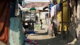 FILE - A girl from the Rohingya community stands outside a shop in a camp in New Delhi, India October 4, 2018. (REUTERS/Adnan Abidi)