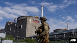 FILE - A Russian serviceman patrols the territory of the Zaporizhzhia Nuclear Power Station in Ukraine, May 1, 2022.